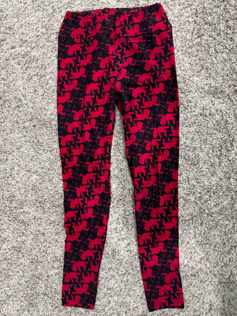 LuLaRoe red cupid leggings on black background OS fits 2-10